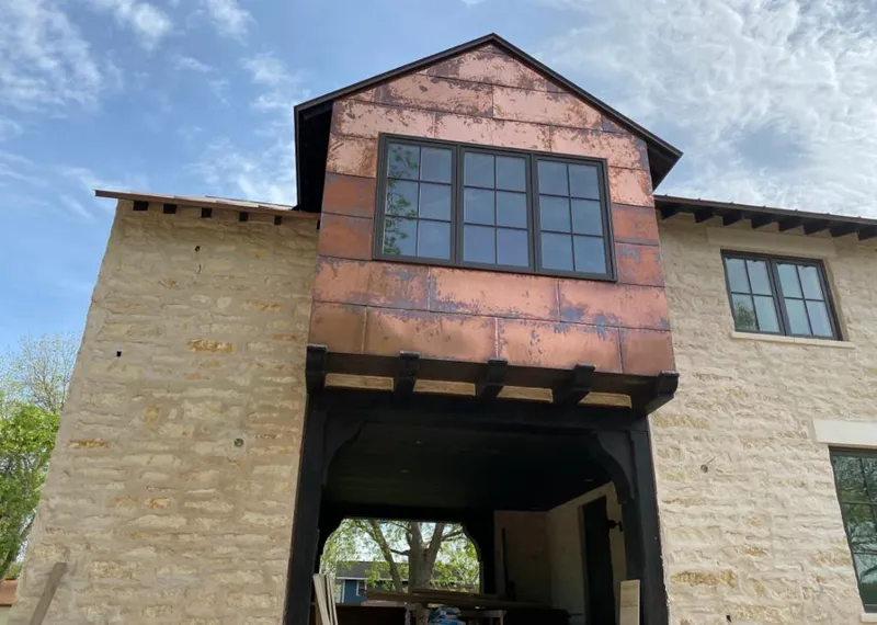 Copper metal panel facade on a stone building for Roof Repair in Cape Canaveral
